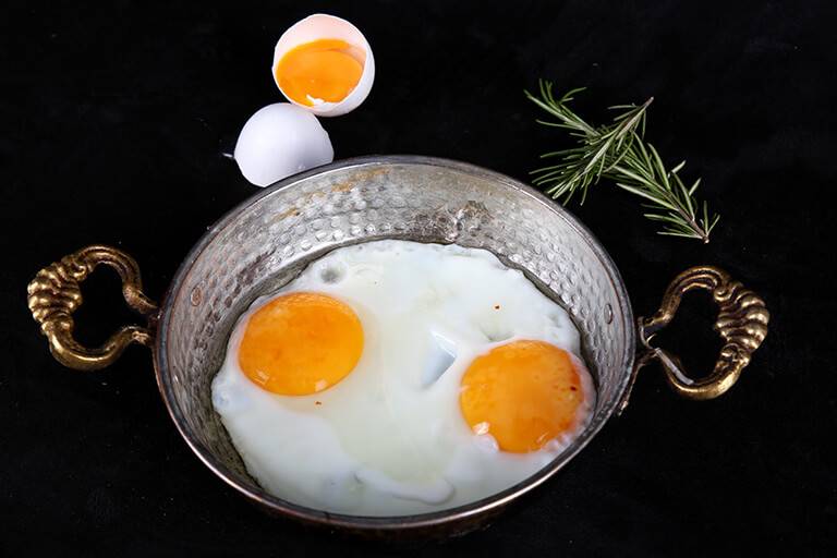 Double-yolk egg cooked in a pan