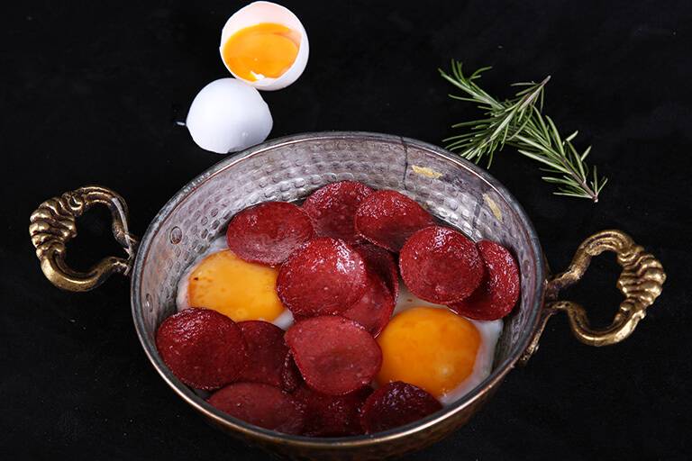 Pan-fried double-yolk egg with sucuk