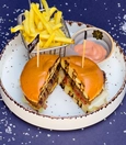 Classic burger with dipping sauce and fries