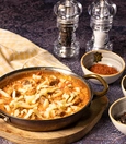 Menemen with kavurma and kaşar cheese