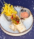Meat döner wrap with dip sauce and fries