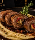 Rolled beef tenderloin served with creamy mushrooms