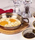 Pan-fried eggs with white cheese