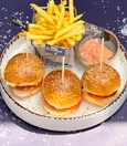 3 mini burgers with dip sauce and fries