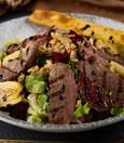 Freshly seasoned grilled beef tenderloin salad