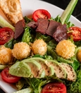 Green salad with avocado and cheese