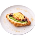 Croissant with avocado and salmon, soft scrambled egg