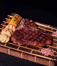 T-bone steak with baby potatoes and vegetables