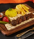 Akçaabat köfte with potatoes, rice, roasted tomato and pepper