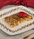 Sweet crepe with strawberry, banana and chocolate sauce