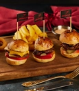 Mini burger (classic, cheese, or mushroom) with onion rings and fries