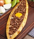 Pide with kavurma and kaşar cheese