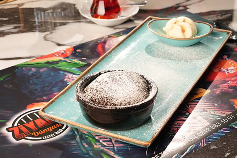 Chocolate soufflé with ice cream and cream