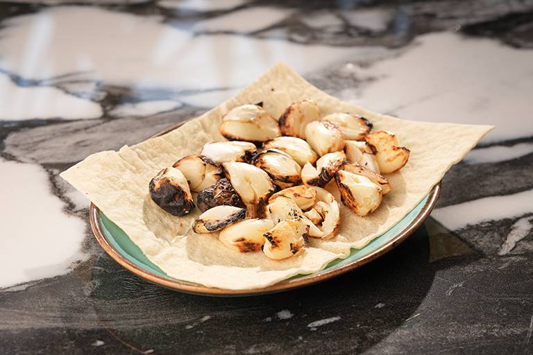 Ember-roasted garlic